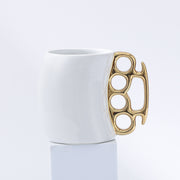 White cup with gold handle