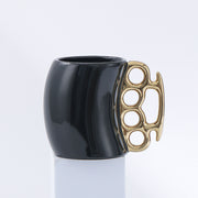 Black cup with gold handle