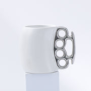 White cup with silver handle